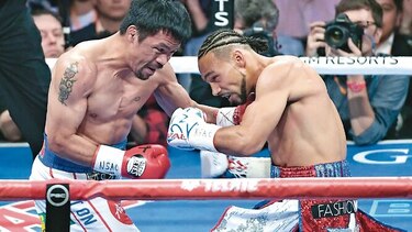 Pacquiao vence a Thurman y captura cetro