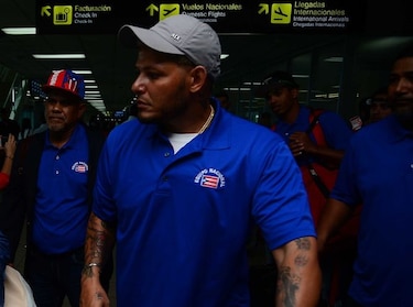 El boricua Yadier Molina gana premio Roberto Clemente