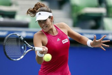 Wozniacki y Muguruza avanzan a cuartos de final